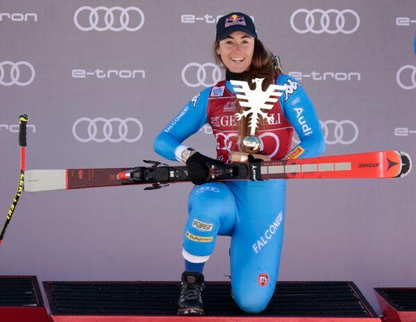 Italy's Sofia Goggia celebrates on the podium after winning an alpine ski, women's World Cup super-G race in Val D'Isere, France, on Dec. 19, 2021. (Giovanni Pizzato/AP Photo)