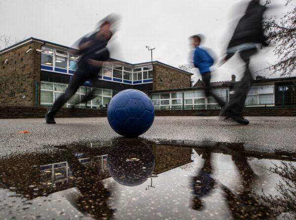 Students play on a playground at a school in the UK in a file photo. (Danny Lawson/PA)