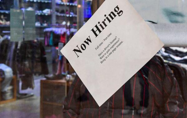A "Now Hiring" sign is placed on the front window of a store in Montebello, California, on Dec. 9, 2021, amid a nationwide labour shortage. (Frederic Brown/AFP via Getty Images)