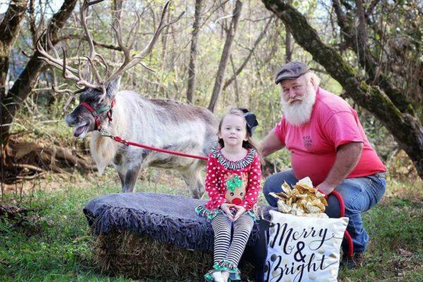 Scott Allen, who inherited land passed down from his grandfather, sits with his granddaughter, Kimberlyn Allen, part of the youngest generation now working on the farm that rents animals for Christmas and Easter appearances. (Scott Allen)