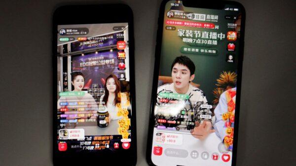 Livestreaming sessions by Li Jiaqi (R) and Viya (L) are seen on Alibaba's e-commerce app Taobao displayed on mobile phones on Dec.14, 2021. (Florence Lo/Reuters)