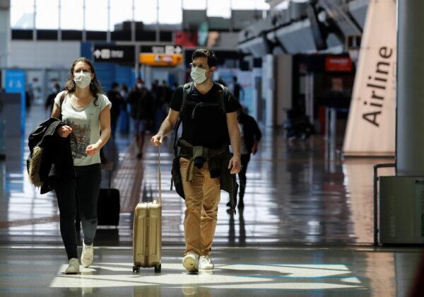 Travelers in the Fiumicino Airport near Rome, Italy, on May 17, 2021. (Remo Casilli/Reuters)