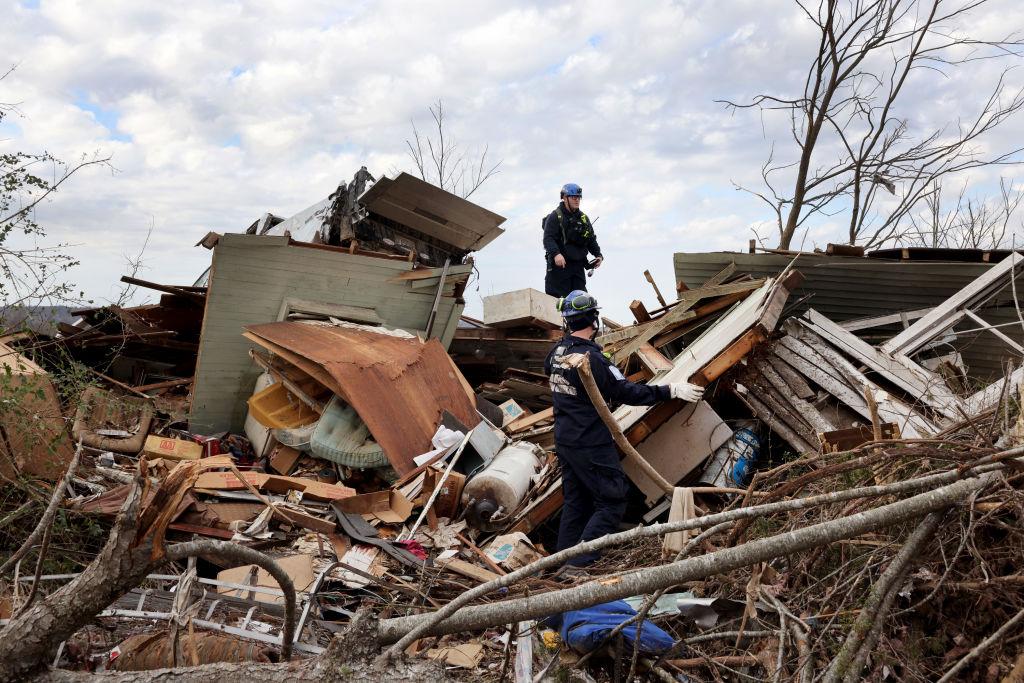 Members of the Ohio Task Force One search-and-recovery team searched debris for victims of the tornado on Dec. 14, 2021, in Dawson Springs, Kentucky. (Scott Olson/Getty Images)