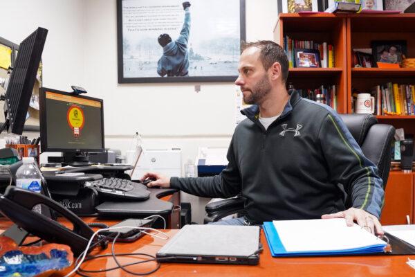 Hutsonville High School Principal Travis Titsworth in his office on Dec. 17, 2021. (Cara Ding/The Epoch Times)