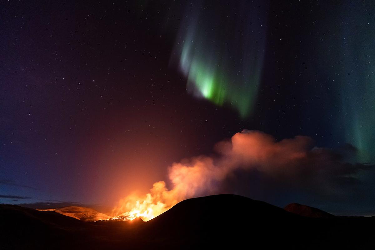 “Volcanic Aurora Borealis” by Jeroen Van Nieuwenhove, Geldingadalir, Iceland. (Courtesy of Jeroen Van Nieuwenhove via <a href="https://capturetheatlas.com/">Capture the Atlas</a>)