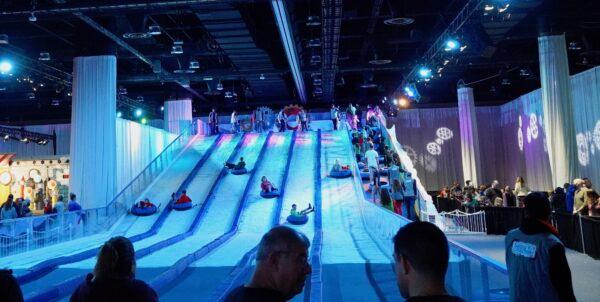 Vistors to the Christmas 2021 Alpine Village at the Gaylord Palms Resort in Kissimmee, Florida can pay $22 for an all-day ticket to go snow-tubing inside. (Natasha Holt/The Epoch Times)