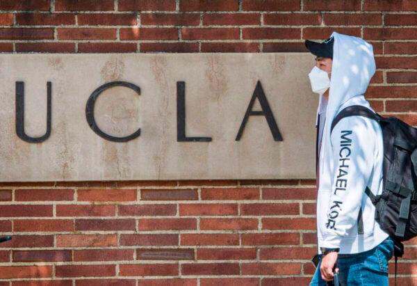 A student wears a face mask on the campus of the UCLA college in Westwood, Calif., on March 6, 2020. (Mark Ralston/AFP via Getty Images)