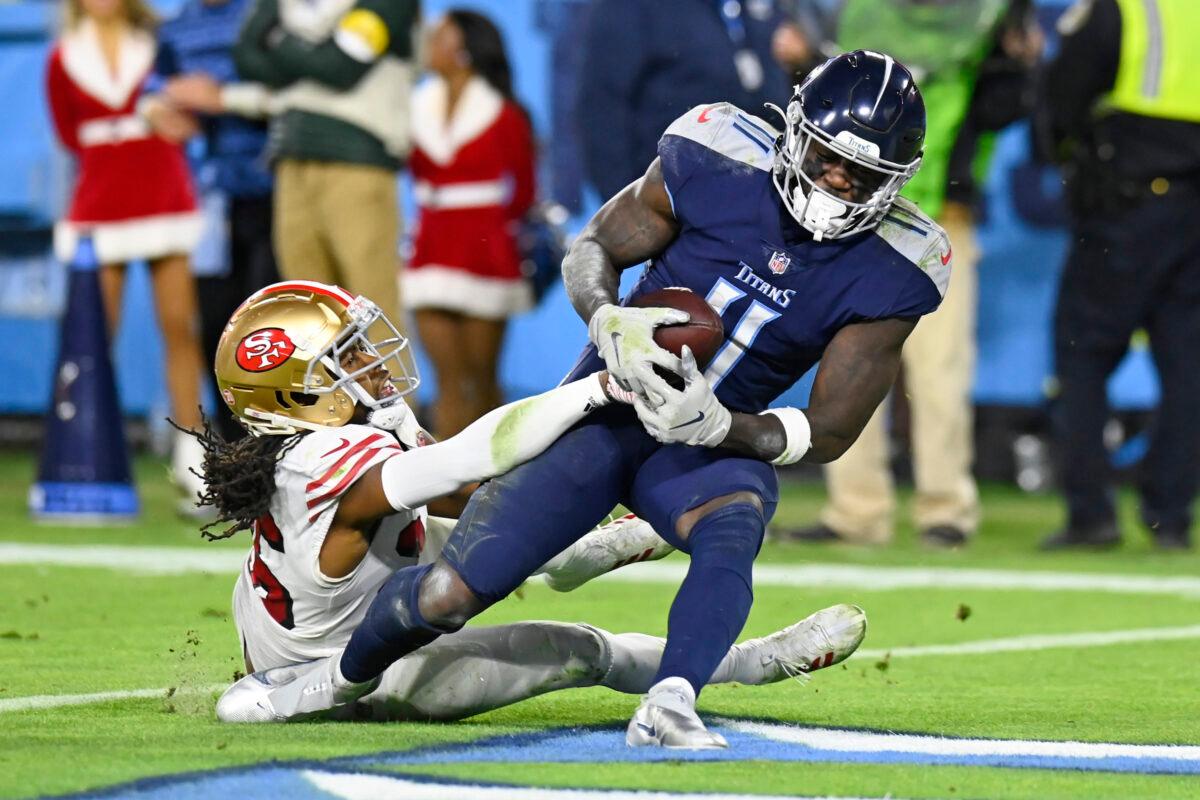 Tennessee Titans wide receiver A.J. Brown (11) catches a touchdown pass as he is defended by San Francisco 49ers cornerback Josh Norman, left, in the second half of an NFL football game, in Nashville, on Dec. 23, 2021. (Mark Zaleski/AP Photo)