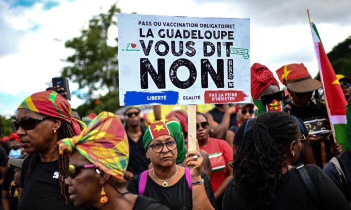 Protesters Storm Guadeloupe Legislature Over Vaccine Rules