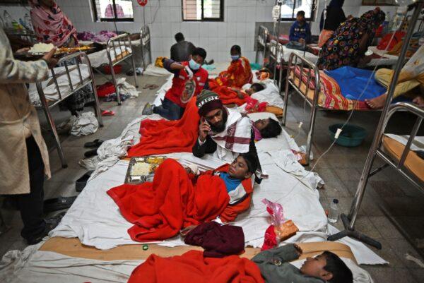 Survivors and injured of a ferry fire get treated at a government medical hospital, in Barishal, Bangladesh, on Dec. 24, 2021. (Niamul Rifat/AP Photo)