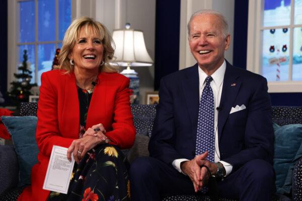 President Joe Biden and First Lady Jill Biden participate in an event to call NORAD and track the path of Santa Claus on Christmas Eve in the South Court Auditorium of the Eisenhower Executive Building in Washington on Dec. 24, 2021. (Alex Wong/Getty Images)