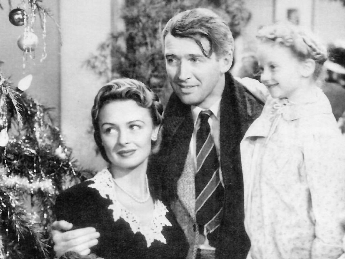 Jimmy Stewart, Donna Reed, and Karolyn Grimes in "It's a Wonderful Life." (Public domain)