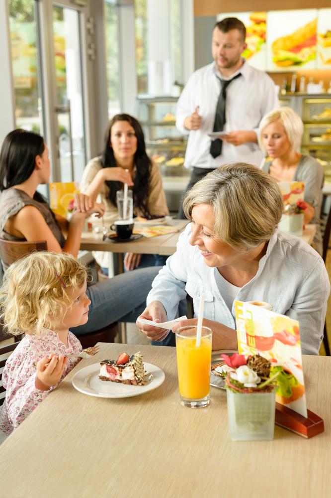 For a change of routine, taking a child out for a meal can allow for more one-on-one time. (CandyBox Images/Shutterstock)