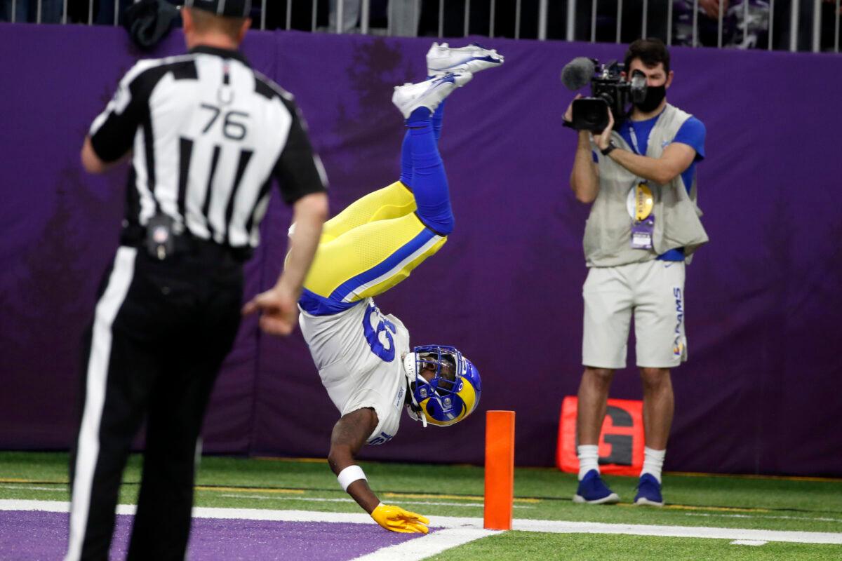 Los Angeles Rams’ Brandon Powell flips into the end zone during a 61-yard punt return for a touchdown in the second half of an NFL football game against the Minnesota Vikings in Minneapolis, on Dec. 26, 2021. (Bruce Kluckhohn/AP Photo)