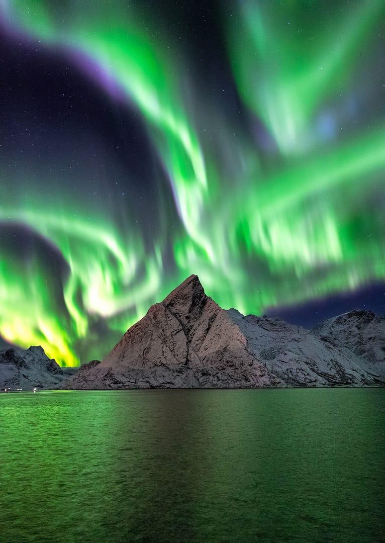 “Reine Northern Lights” by Frank Olsen, Reine, Lofoten Islands, Norway. (Courtesy of Frank Olsen via <a href="https://capturetheatlas.com/">Capture the Atlas</a>)