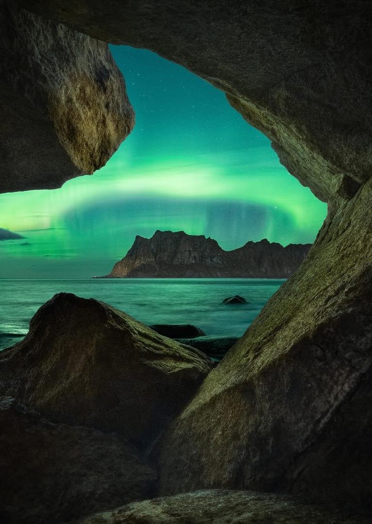 “The Aurora Cave” by Giulio Cobianchi, Lofoten Islands, Norway. (Courtesy of Giulio Cobianchi via <a href="https://capturetheatlas.com/">Capture the Atlas</a>)