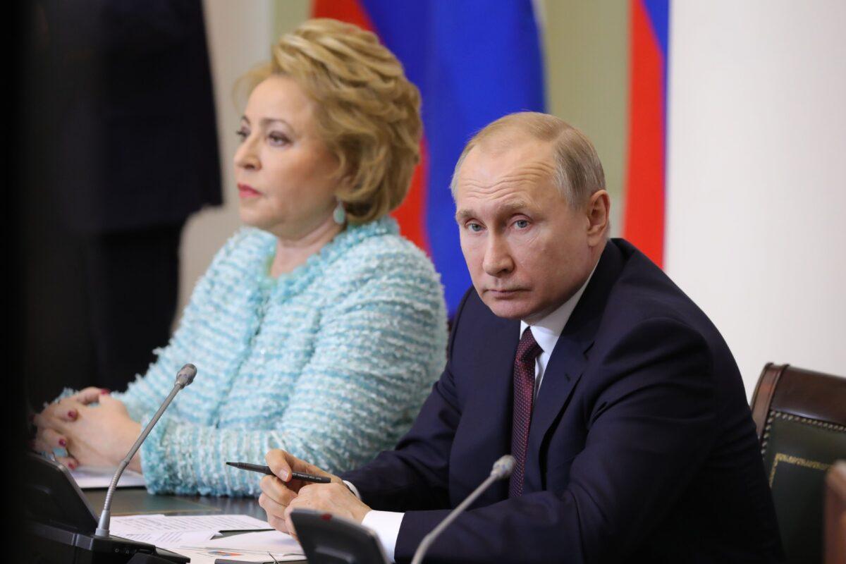 Chairwoman of the Russian Federation Council Valentina Matviyenko (left) and Russian President Vladimir Putin (R) attend a meeting with members of the Legislator Council under the Russian Federal Assembly in Saint Petersburg on April 27, 2018. (Mikhail Klimentyev/Sputnik/AFP via Getty Images)