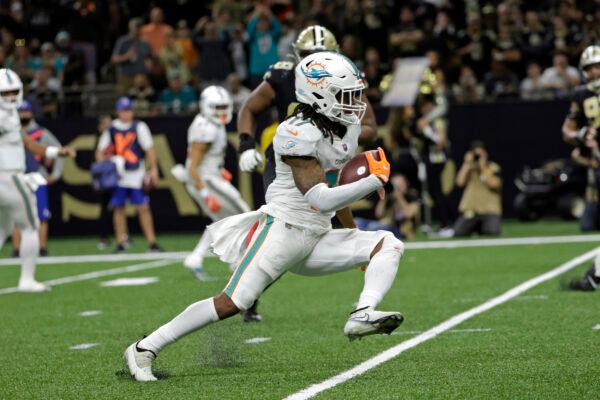 Miami Dolphins' Jaylen Waddle (17) runs for a touchdown during the second half of an NFL football game against the New Orleans Saints in New Orleans, on Dec. 27, 2021. (Derick Hingle/AP Photo)