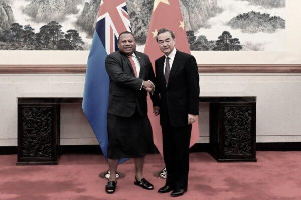 Chinese Foreign Minister Wang Yi (R) shakes hands with Fiji's Foreign Affairs Minister Inia Seruiratu before their meeting at the Diaoyutai State Guesthouse in Beijing on June 11, 2019. (Photo by WANG ZHAO / POOL / AFP) (Photo credit should read WANG ZHAO/AFP via Getty Images)
