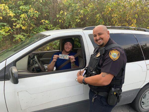 Officer J. Santiago of the Ocala Police Department in Florida surprised Anthony Talley with a gift of $100, instead of a traffic ticket, after pulling him over during Operation Secret Santa 2021. (Courtesy of Ocala Police Department)