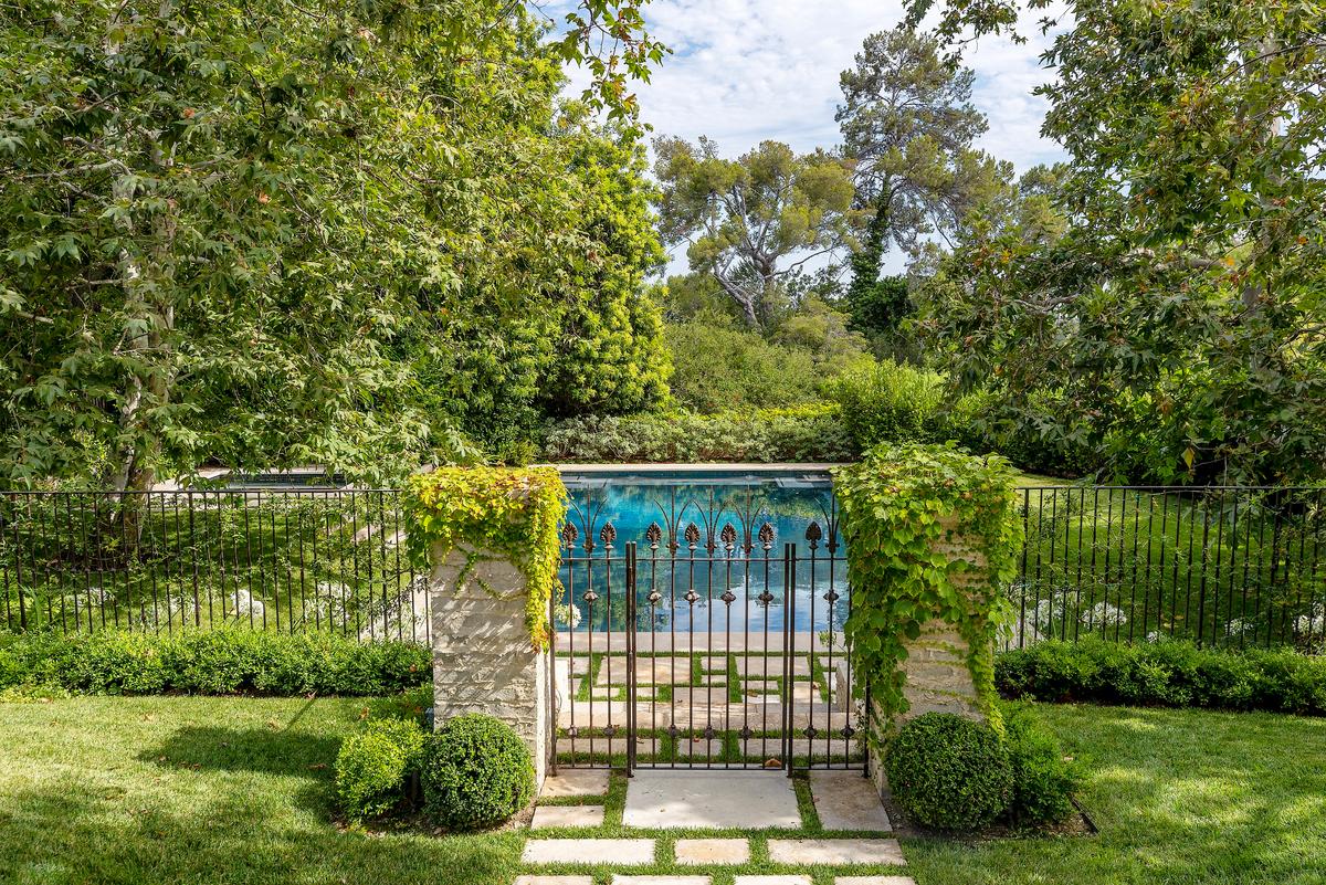 There’s a wonderful sense that this house is enveloped in the protective cloak of nature. The pool and the rest of the outdoor features are draped in greenery and nature. (Courtesy of Jim Bartsch/Jade Mills)