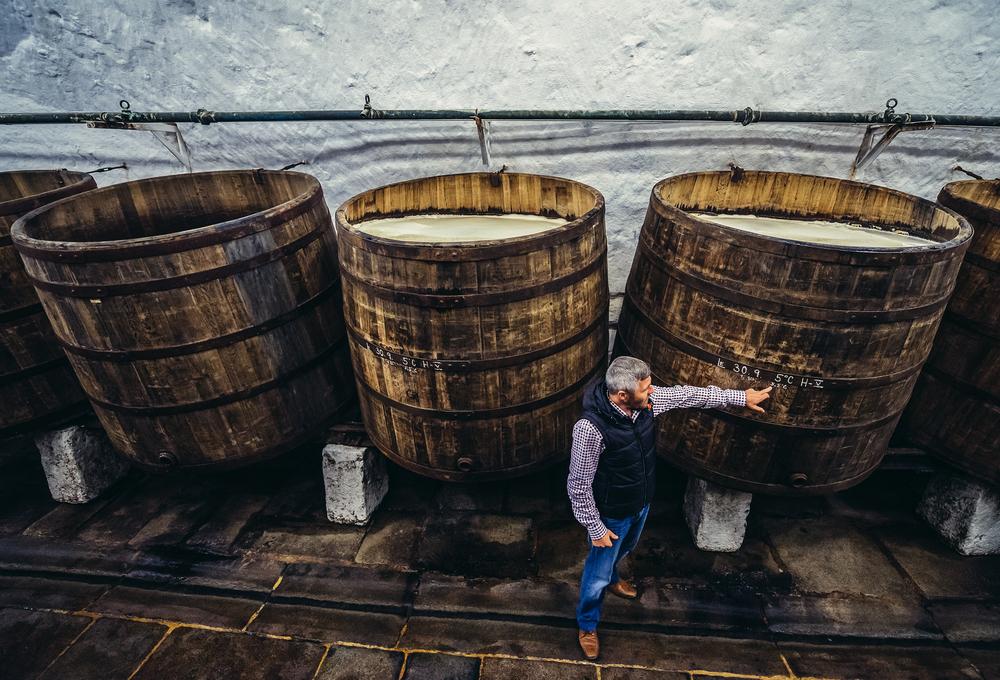<span class="s1">A guide shows old wooden barrels in the cellars at Pilsner Urquell Brewery. </span><span class="s2">(<a href="https://www.shutterstock.com/it/g/fotokon"><span class="s3">Fotokon</span></a>/Shutterstock)</span>