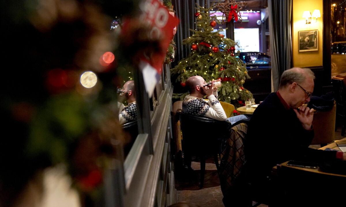 A man drinks a pint at a pub in Battersea, south London, on Dec. 27, 2021. (Kirsty O'Connor/PA)
