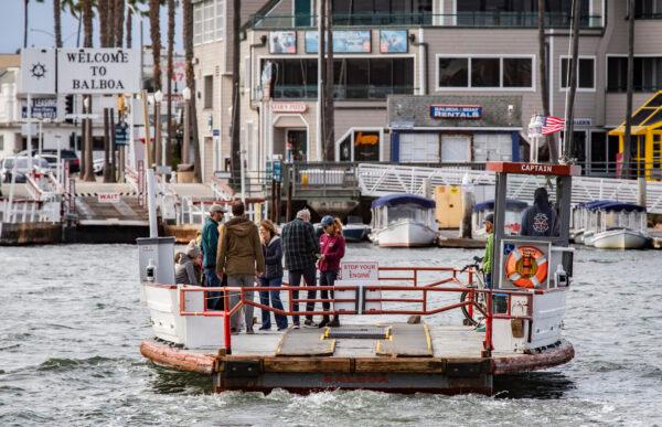 People enjoy riding the Balboa Island Ferry boats across the harbor in Newport Beach, Calif., on Dec. 29, 2021. (John Fredricks/The Epoch Times)