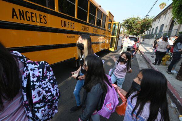 Students and parents arrive masked for the first day of the school year at Grant Elementary School in Los Angeles, on Aug. 16, 2021. (Robyn Beck/AFP via Getty Images)