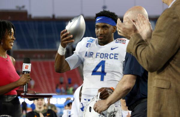 Haaziq Daniels (4) of the Air Force Falcons accepts the MVP trophy after his team defeated the Louisville Cardinals 31-28 in the First Responders Bowl at Gerald J. Ford Stadium in Dallas on Dec. 28, 2021. (Ron Jenkins/Getty Images)