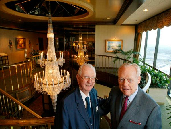 Two of the original members, Bryan Poff, left, and William Alvin "Tex" Moncrief Jr. stand together in the main lobby of the Petroleum Club, in Fort Worth, Texas, on Aug. 28, 2003. (Rodger Mallison/Star-Telegram via AP)