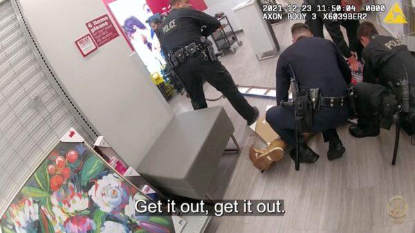 Bodycam footage shows Los Angeles Police Department officers surrounding the assault suspect at a shopping mall in North Hollywood, Calif., on Dec. 23, 2021, in this still image taken from a video. (LAPD/Handout via Reuters)