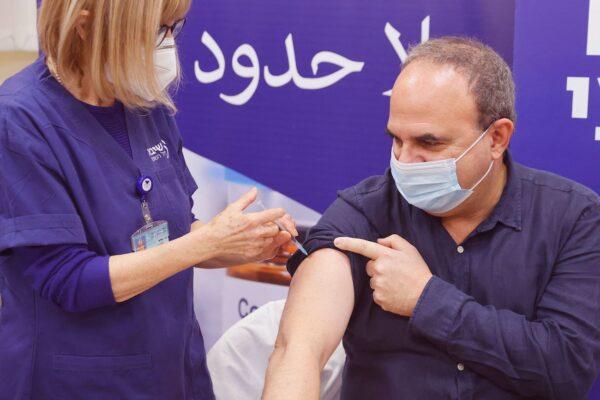 An Israeli man receives a fourth dose of the Pfizer-BioNTech COVID-19 vaccine, as the Israeli hospital conducts a trial of the vaccine's fourth jab on staff volunteers, at the Sheba Medical Center in Ramat Gan near Tel Aviv, Israel, on Dec. 27, 2021. (Jack Guez/AFP via Getty Images)