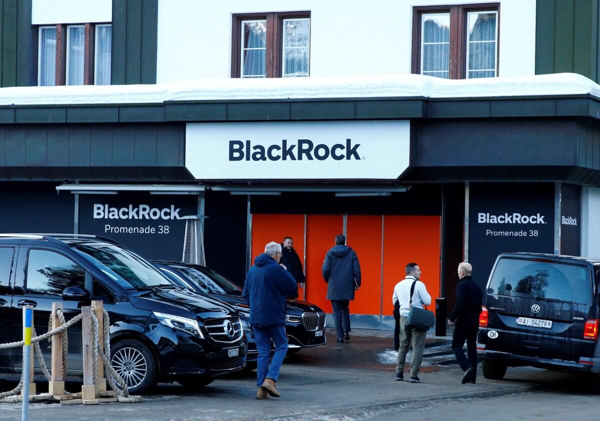 People are seen in front of a showroom that hosts BlackRock in Davos, Switzerland, on Jan. 22, 2020. (Arnd Wiegmann/Reuters)