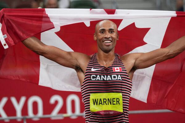 Damian Warner reacts after winning the gold medal for the decathlon at the 2020 Summer Olympics in Tokyo on Aug. 5, 2021. (AP Photo/Matthias Schrader)