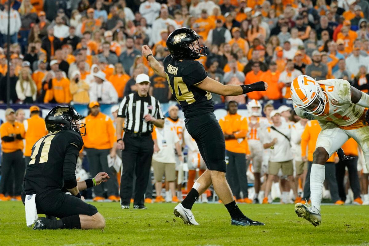 Purdue placekicker Mitchell Fineran (24) watches along with holder Jack Albers (11) as Fineran's 39-yard field goal goes through the uprights to beat Tennessee in overtime in the Music City Bowl NCAA college football game in Nashville, on Dec. 30, 2021. (/Mark HumphreyAP Photo)