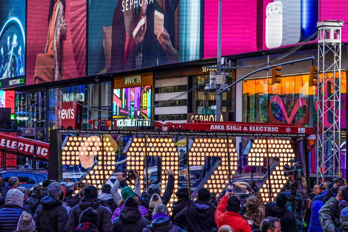 The 2022 sign that will be lit on top of a building on New Year's Eve is displayed in Times Square, N. Y., on Dec. 20, 2021. (Seth Wenig/AP Photo)