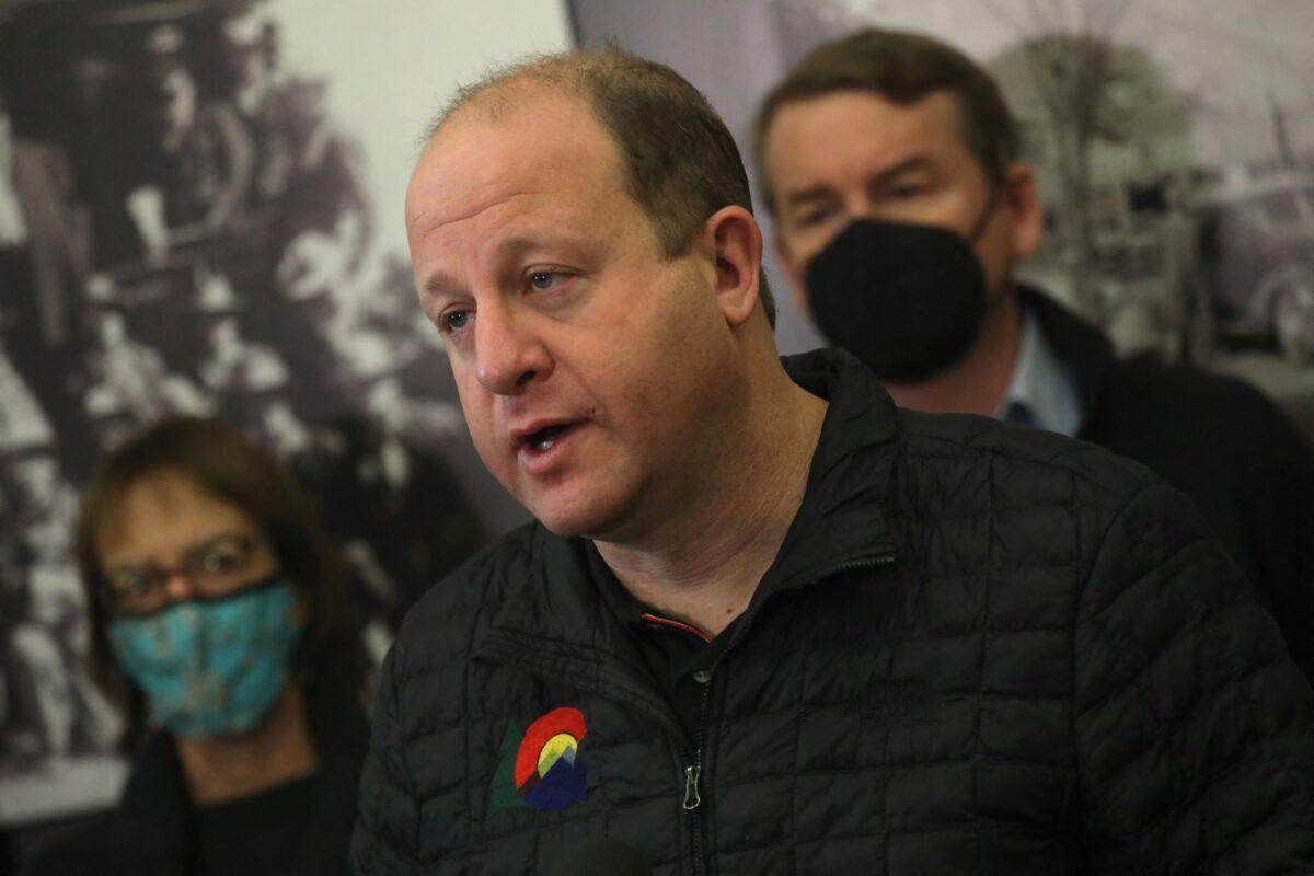 Colorado Governor Jared Polis speaks at a news conference in Boulder, Colo., on Dec. 31, 2021. (Nathan Frandino/Reuters)
