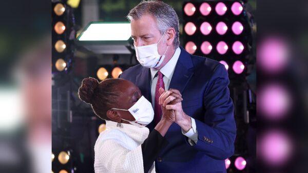 Chirlane McCray and Bill de Blasio dance onstage after the ball drop during the Times Square New Year's Eve 2022 Celebration in New York City, on Jan. 1, 2022. (Arturo Holmes/Getty Images)