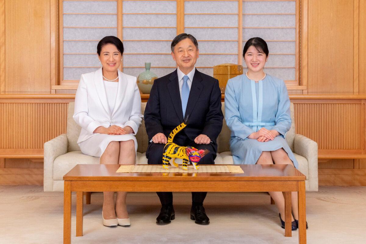 Japan's Emperor Naruhito, Empress Masako, left, and their daughter Princess Aiko pose for a photograph during a family portrait session ahead of the New Year, at the Imperial Palace in Tokyo on Dec. 21, 2021. (Imperial Household Agency of Japan via AP)