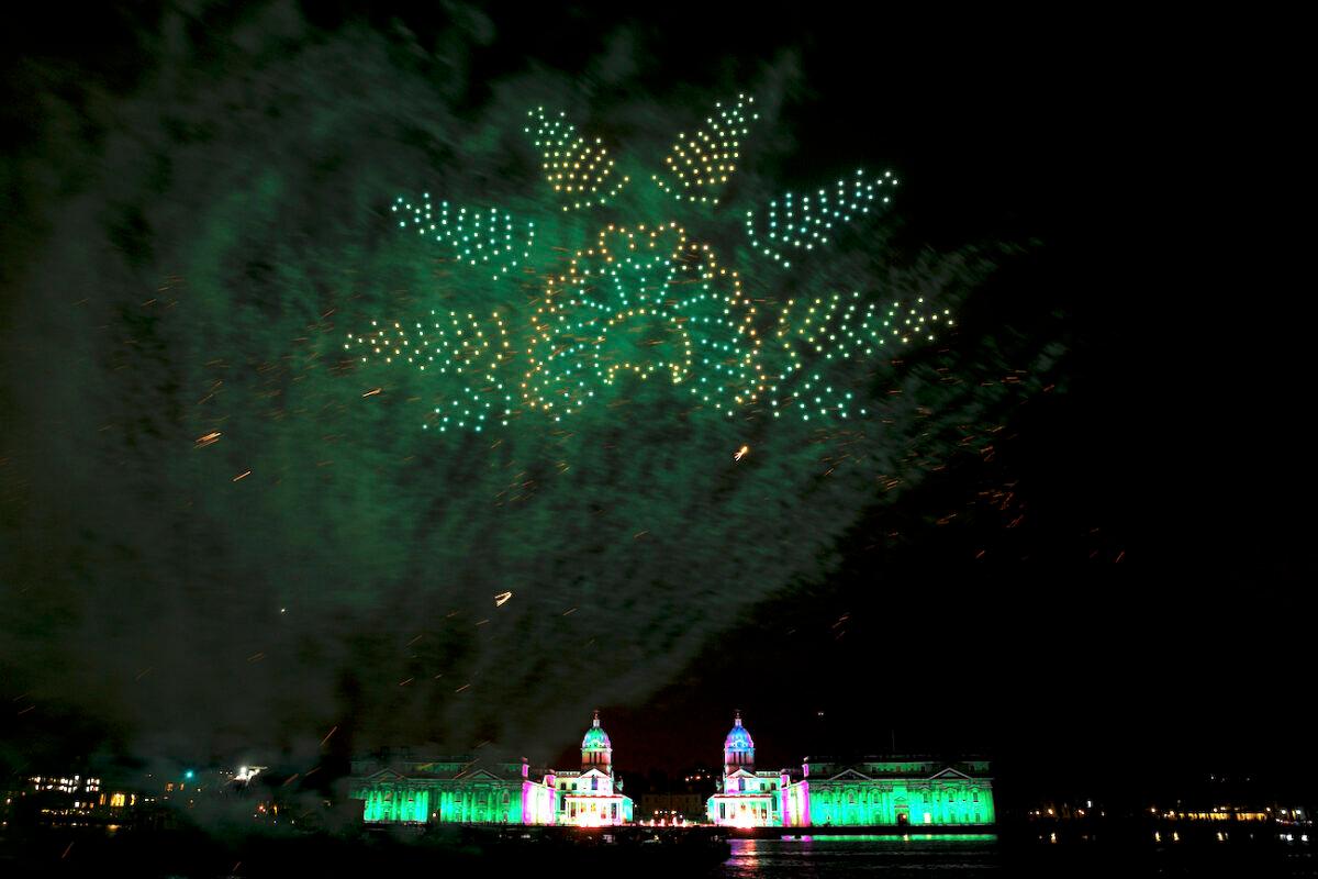Fireworks and a drone light show are seen over the Old Royal Naval College in Greenwich to bring in the New Year in London, England, on Jan. 1, 2022. (Rob Pinney/Getty Images)