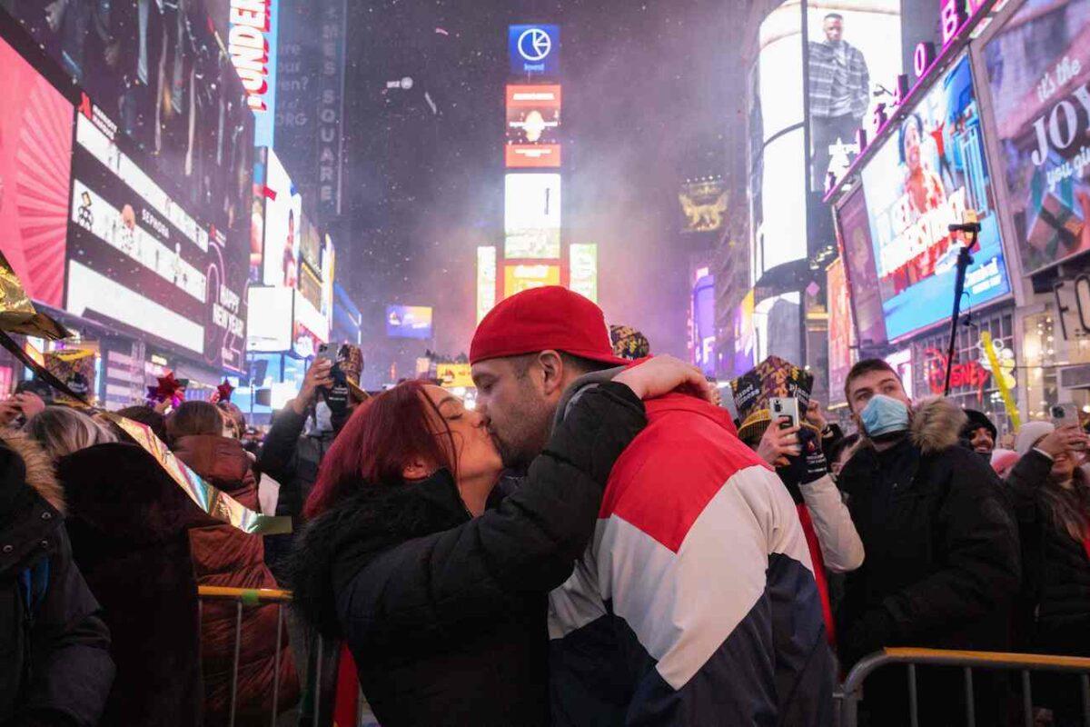 A couple kisses as they celebrate the New Year at Times Square in New York City on Jan. 1, 2022. (Yuki Iwamura/AFP via Getty Images)