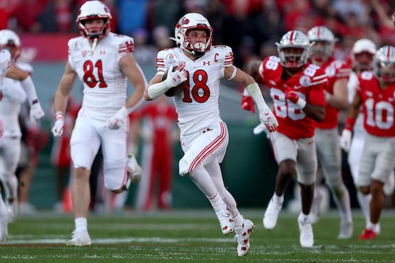 Britain Covey #18 of the Utah Utes rushes for a touchdown against the Ohio State Buckeyes during the second quarter in the Rose Bowl Game at Rose Bowl Stadium, in Pasadena, Calif., on Jan. 1, 2022. (Sean M. Haffey/Getty Images)