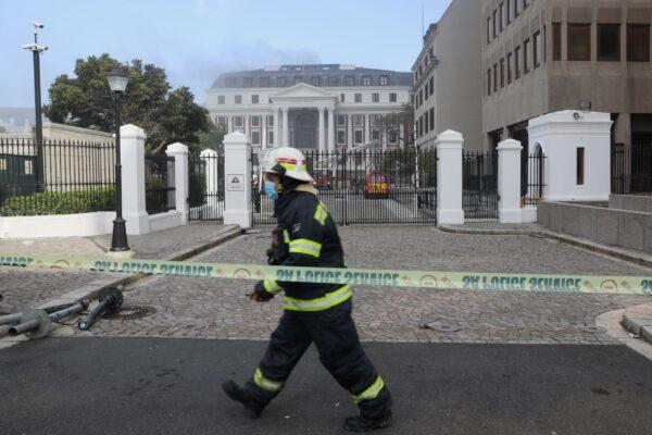 Firefighters work after a fire broke out in the Parliament in Cape Town, South Africa, on Jan. 2, 2022. (Sumaya Hisham/Reuters)