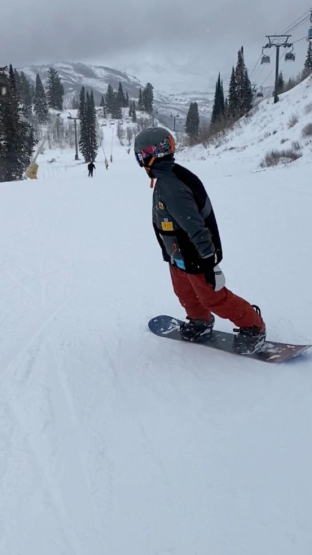 The author's son tries snowboarding at the Snowbasin Resort in Ogden, Utah. (Margot Black)
