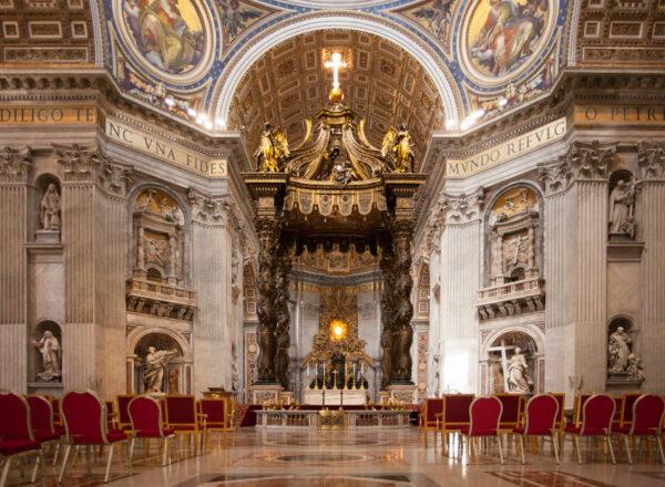 The Baldacchino stands at the center of the basilica and is one of two altars where the pope may deliver Mass. The eight-story bronze canopy humanizes the giant scale of the space beneath the dome and draws focus to the location of St. Peter’s tomb. (J.H.Smith/Cartio)