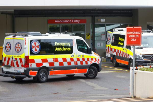 Ambulances arrive at St Vincent's Hospital on December 28, 2021 in Sydney, Australia. COVID-19 testing clinics are at capacity in Sydney with increased demand and centres closing for public holidays. (Jenny Evans/Getty Images)