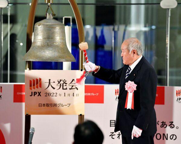 Japan's Finance Minister Shunichi Suzuki rings a bell during a ceremony to mark the first trading day of the year at the Tokyo Stock Exchange in Tokyo, Japan, on Jan. 4, 2022. (Kyodo News via AP)