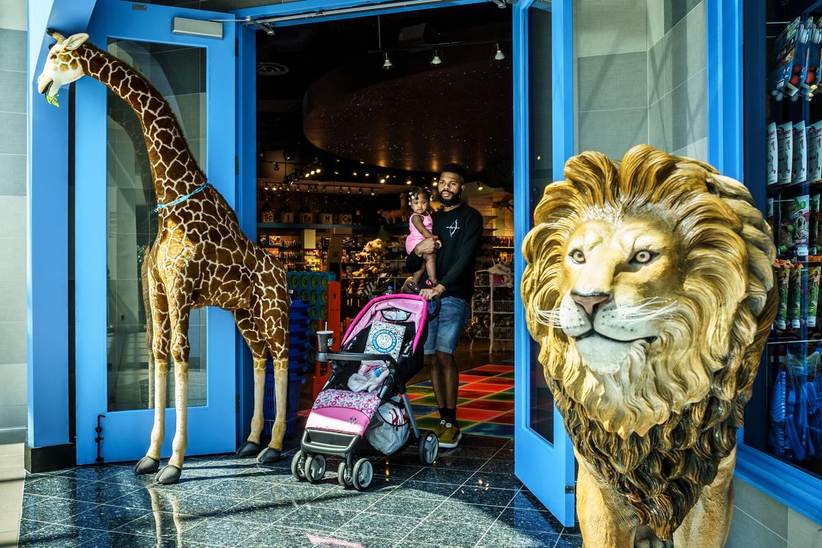 A shopper exits the Legacy Toys store at the Mall of America in Bloomington, Minn., on June 16, 2020. (KEREM YUCEL/AFP via Getty Images)