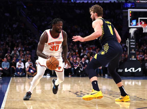 Julius Randle #30 of the New York Knicks drives against Domantas Sabonis #11 of the Indiana Pacers during their game at Madison Square Garden, in New York City, on Jan. 4, 2022. (Al Bello/Getty Images)